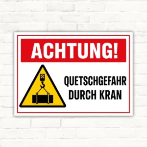 Achtung! Quetschgefahr durch Kran Schild mit Warnsymbol, rotem Kopfbereich und schwarzem Text als horizontales Warnschild.