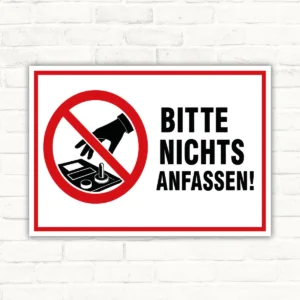 Verbotsschild mit rotem Symbol und dem Text „Bitte nichts anfassen!“ auf weißem Hintergrund für klare Hinweise.