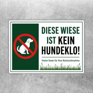 Hundeverbotsschild Diese Wiese ist kein Hundeklo als Aufkleber mit rotem Verbotszeichen auf grünem Hintergrund.