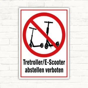 Schild mit rotem Verbotssymbol und Text „Tretroller/E-Scooter abstellen verboten“ als Verbotsschild.