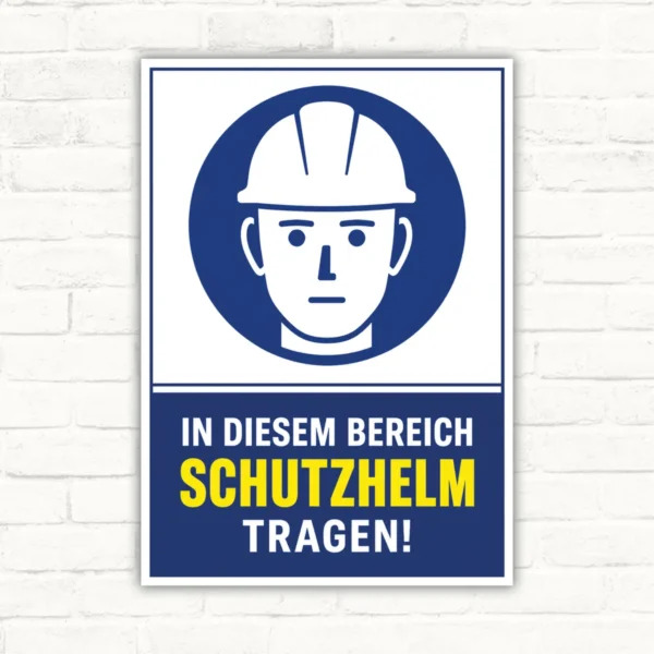Schutzhelm tragen Schild mit Helm-Piktogramm und Text „In diesem Bereich Schutzhelm tragen!“ als Hinweisschild.