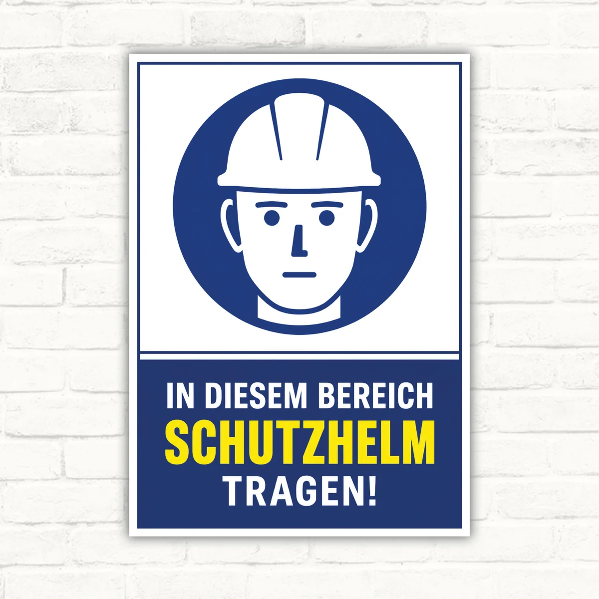 Schutzhelm tragen Schild mit Helm-Piktogramm und Text „In diesem Bereich Schutzhelm tragen!“ als Hinweisschild.