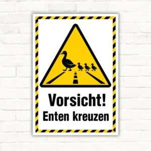 Warnschild mit gelbem Dreiecks-Motiv und dem Text „Vorsicht! Enten kreuzen“ als stabiles Aluschild.