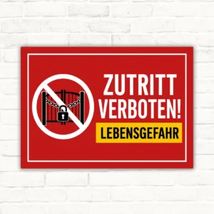 Zutritt verboten Schild mit rotem Warnmotiv und Lebensgefahr-Hinweis als bedrucktes Verbotsschild.