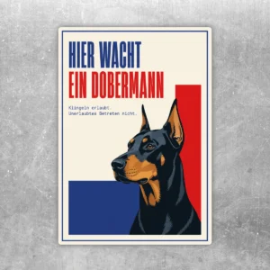 Dobermann Aufkleber mit Text Hier wacht ein Dobermann, cremefarbenem Hintergrund und Hundeporträt in Blau, Rot und Braun.
