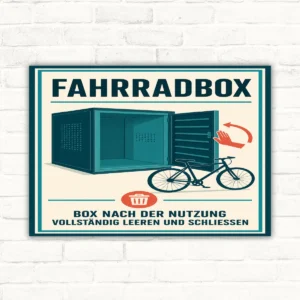 Fahrradbox Schild mit Text „Box nach der Nutzung vollständig leeren und schliessen“ sowie Fahrradbox-Illustration.