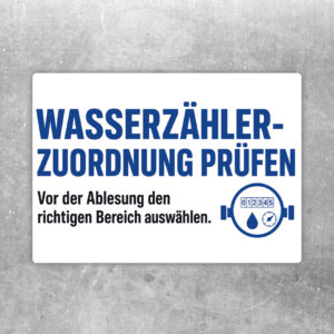 Zählerzuordnung prüfen Aufkleber im Querformat mit Gebäudegrafik und Hinweis vor der Ablesung den Bereich auszuwählen.