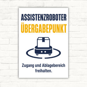 Übergabepunkt für Material Schild mit Text „Zugang und Ablagebereich freihalten“ und Assistenzroboter-Motiv.