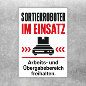 Aufkleber mit Sortierroboter im Einsatz und Hinweis, den Arbeits- und Übergabebereich freizuhalten.