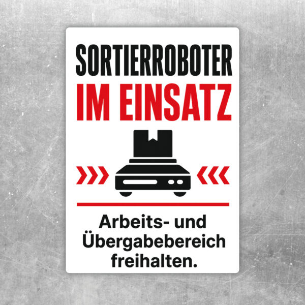 Aufkleber mit Sortierroboter im Einsatz und Hinweis, den Arbeits- und Übergabebereich freizuhalten.