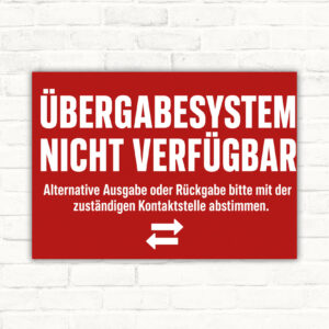 Hinweisschild mit Text „Übergabesystem nicht verfügbar“ und Hinweis zur alternativen Ausgabe oder Rückgabe am Servicebereich.