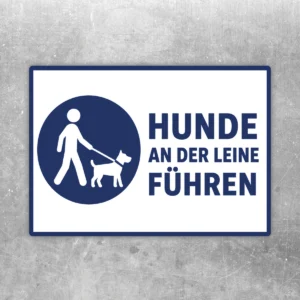 Blau-weißer Hunde an der Leine führen Aufkleber mit Piktogramm von Mensch und angeleintem Hund im Querformat.