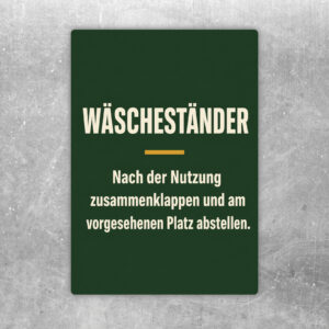 Wäscheständer zusammenklappen Aufkleber mit violettem Rahmen und Hinweis zum Abstellen am vorgesehenen Platz.