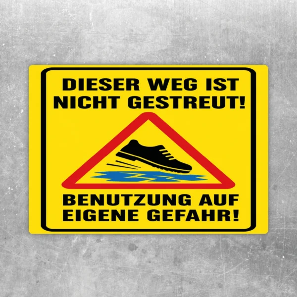 Warnaufkleber mit Text „Dieser Weg ist nicht gestreut“ und rotem Warn-Dreieck auf gelbem Hintergrund.