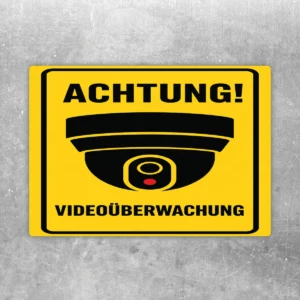 Videoüberwachung Aufkleber mit gelbem Warnhintergrund, Kamerasymbol und dem Text Achtung und Videoüberwachung.