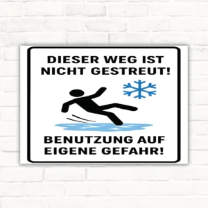 Warnschild mit Text „Dieser Weg ist nicht gestreut! Benutzung auf eigene Gefahr!“ und Rutschfigur auf Eis.