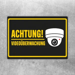 Achtung Videoüberwachung Aufkleber im Querformat mit gelbem Rahmen, Kamerasymbol und klarer Warnwirkung auf schwarzem Hintergrund.