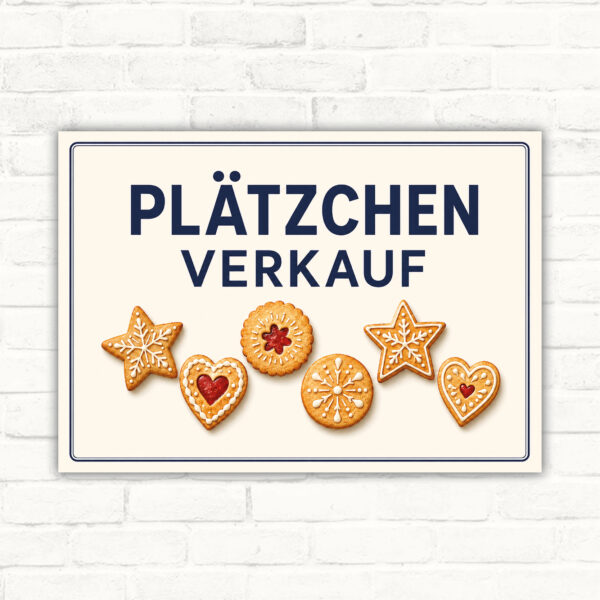 Plätzchen Verkauf Schild mit dekorativen Keksen und großer Überschrift für den Hinweis auf Gebäckverkauf.