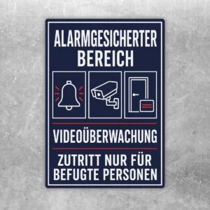 Dunkelblauer Aufkleber Alarmgesicherter Bereich mit Kamera, Alarmglocke und Zutritt nur für befugte Personen.
