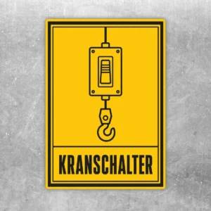 Gelb schwarzer Kranschalter Aufkleber im Hochformat mit Kransteuerung, Hakenmotiv und Text KRANSCHALTER.