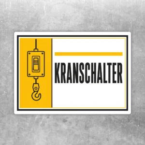 Kranschalter Kennzeichnung Aufkleber im Querformat mit gelbem Symbolfeld, Kranhaken und schwarzem Text auf Weiß.
