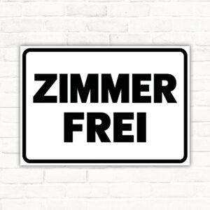 Originalmotiv: schwarzer Schriftzug ZIMMER FREI auf weißem Querformat mit schwarzem Rahmen als Schild