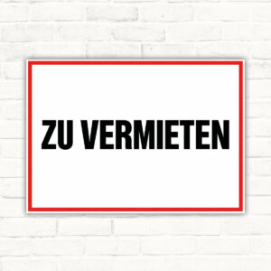 Originalmotiv: schwarzer Schriftzug ZU VERMIETEN auf weißem Querformat mit rotem Rahmen als Schild