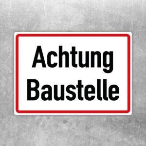 Originalmotiv: schwarzer Text Achtung Baustelle auf weißem Querformat mit rotem Rahmen als Aufkleber