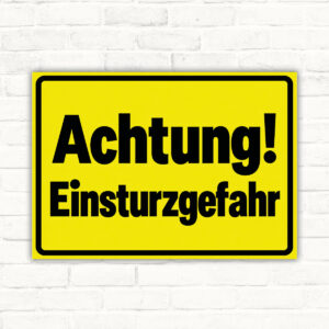 Originalmotiv: Achtung! Einsturzgefahr auf gelbem Grund mit schwarzem Rahmen als Schild